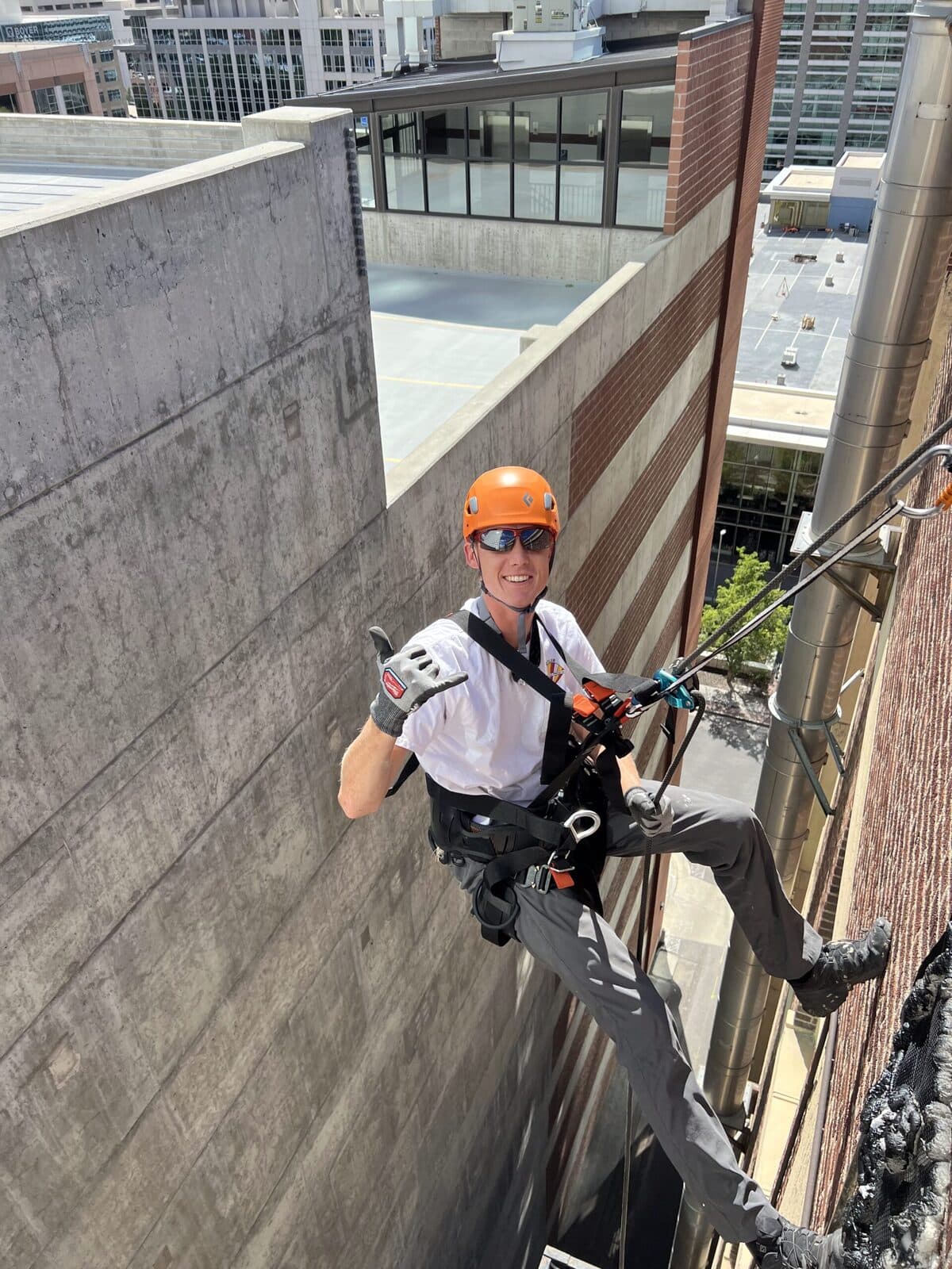 Florida Wildlife Specialists technician on rope during a commercial bat exclusion